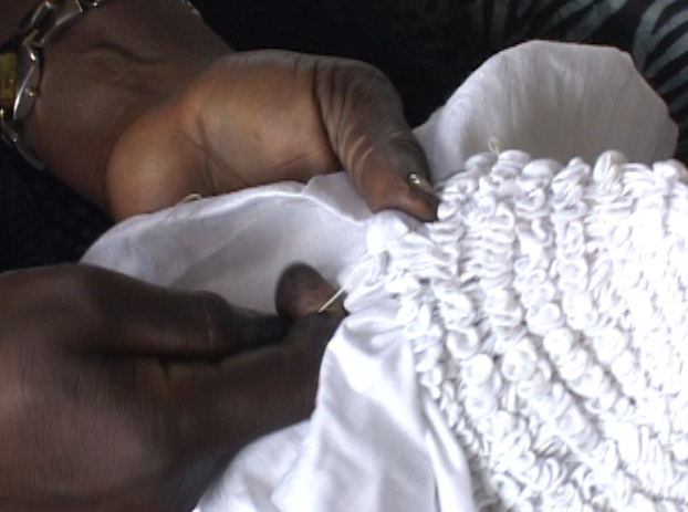 Artist tying cloth for Adire tie-dye, Nike Centre, Oshogbo, Nigeria, 2010. Photo by Mary Lance 