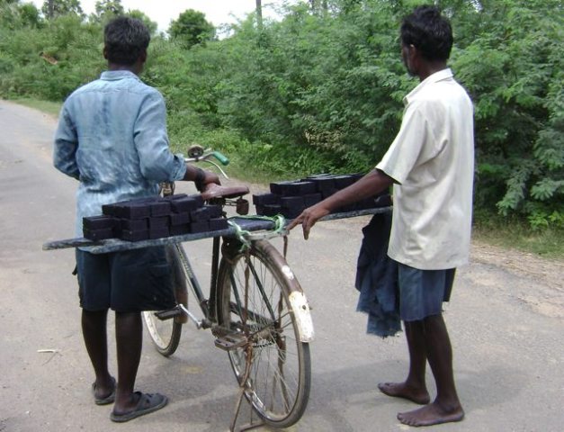 Transporting Indigo dye by bike, India, 2007. Photo by Mary Lance