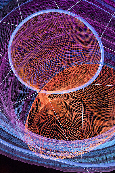 Janet Echelman “Her Secret is Patience” Detail, 2009, 100? wide at top, 15? wide at bottom, painted and galvanized steel and cables; changing sets of recyclable high-tenacity polyester braided twine netting; colored lighting with computerized programming, hand and machine knotting. CREDITS: Client: City of Phoenix Office of Arts and Culture. Studio Echelman Team: Philip Speranza (Design Support), Melanie Rose Peterson (Conceptual Design/Development), Rachel Kaede Newsam (Design Support). Fabrication & Project Engineering: CAID Industries (Tuscon, AZ). Net Engineering: Buro Happold (New York). Aeronautical Engineering: Peter Heppel Associates (Paris). Consultant: Esperanza Architecture (New York). Steel Structure Engineering: M3 Engineering (Tuscon, AZ). Lighting: Vox Arts (Baltimore, MD). Structural Erection: Nexus Steel. Sculptural Foundations: Foresite Design (Berkley, MI). Photo: Janet Echelman.