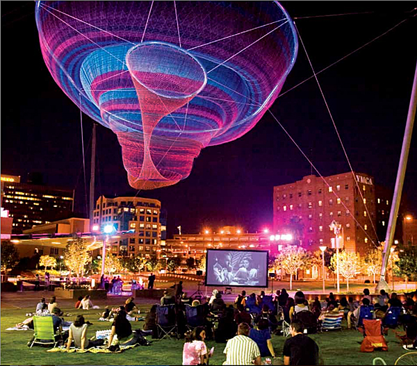 Janet Echelman “Her Secret is Patience” 2009, 100? wide at top, 15? wide at bottom, painted and galvanized steel and cables; changing sets of recyclable high-tenacity polyester braided twine netting; colored lighting with computerized programming, hand and machine knotting. CREDITS: Client: City of Phoenix Office of Arts and Culture. Studio Echelman Team: Philip Speranza (Design Support), Melanie Rose Peterson (Conceptual Design/Development), Rachel Kaede Newsam (Design Support). Fabrication & Project Engineering: CAID Industries (Tuscon, AZ). Net Engineering: Buro Happold (New York). Aeronautical Engineering: Peter Heppel Associates (Paris). Consultant: Esperanza Architecture (New York). Steel Structure Engineering: M3 Engineering (Tuscon, AZ). Lighting: Vox Arts (Baltimore, MD). Structural Erection: Nexus Steel. Sculptural Foundations: Foresite Design (Berkley, MI). Photo Courtesy of Greater Phoenix.