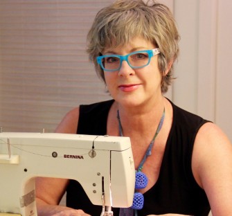 Rich Leisa headshot blue glasses sewing image
