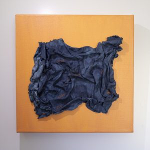 Teddy Milder, "Crushed," Handmade paper, indigo, silk thread 10" x 10" x 1.75," website: 2019, www.teddymilder.com